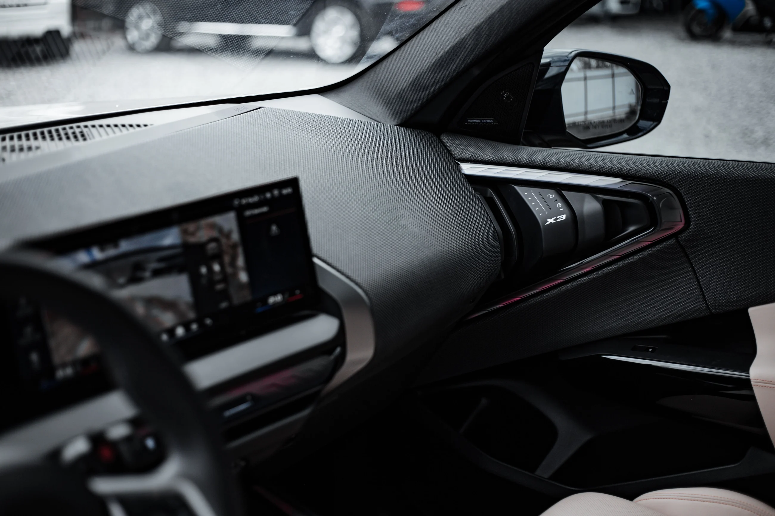 A modern car dashboard and steering wheel