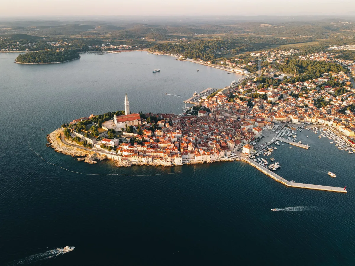 An aerial view of the Rovinj peninsula, its old town and the harbour